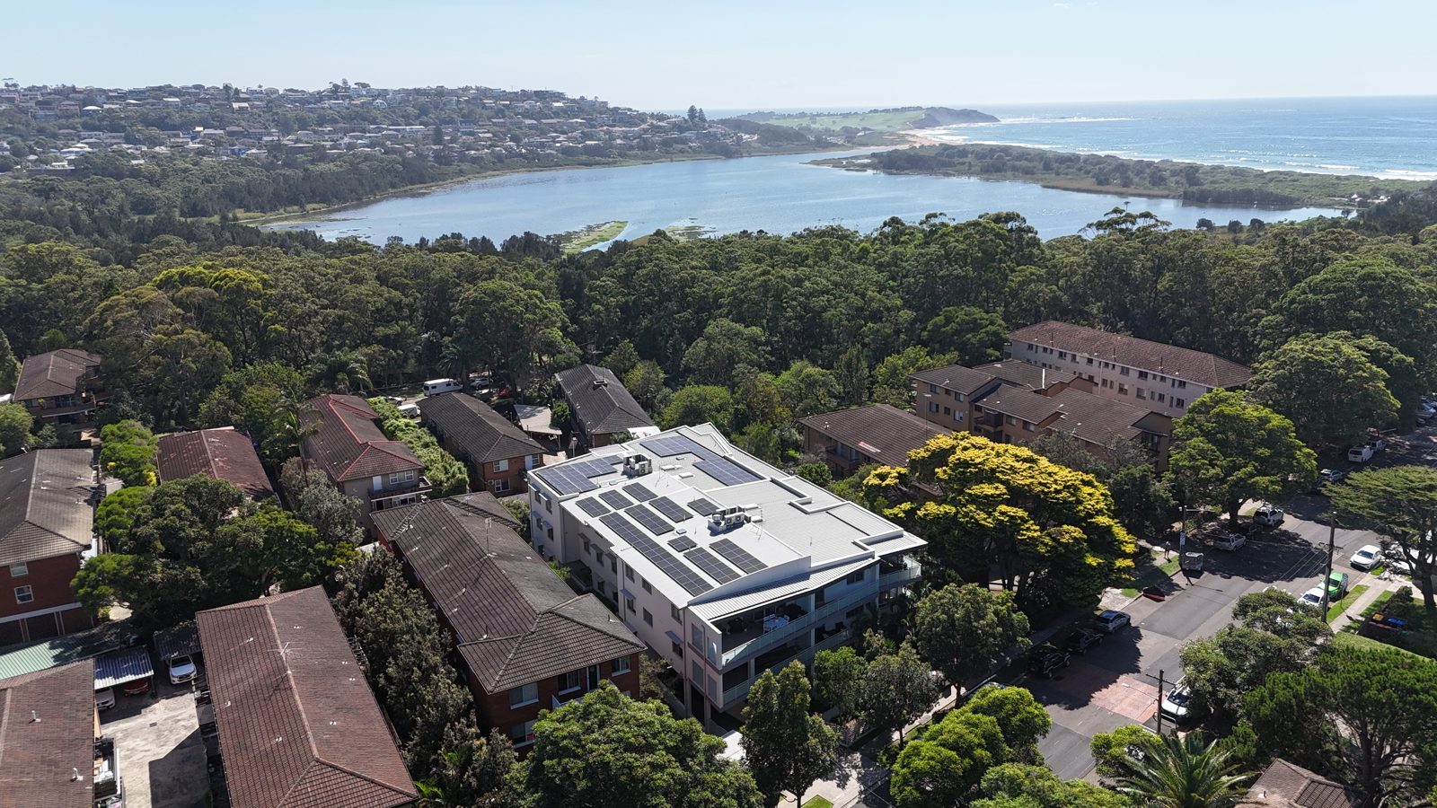 Aerial view of an Allume SolShare shared solar installation on an apartment block