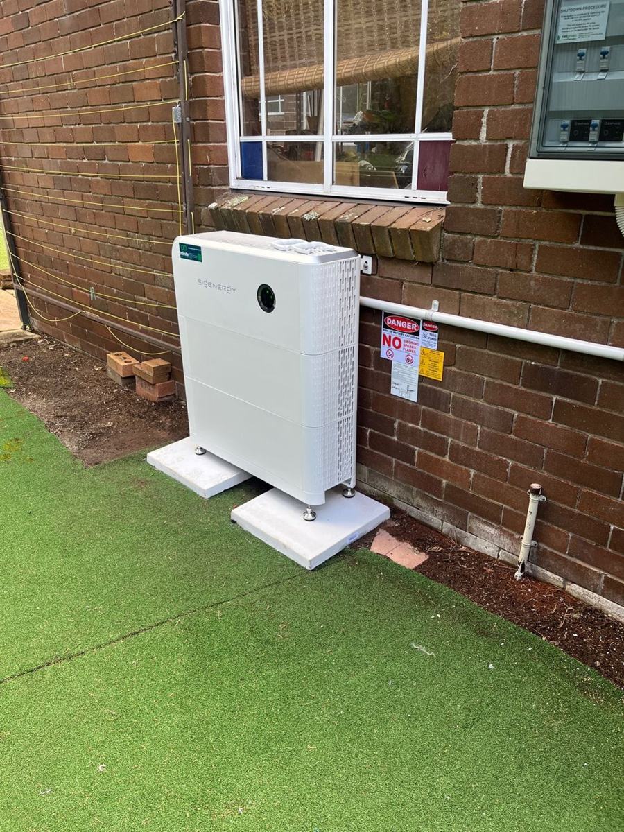 Sigenergy SigenStor home battery installed beside a brick home by Infinite Electrical & Solar